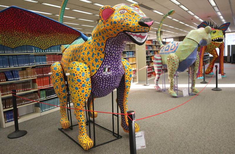 Three of the alebrijes on display Thursday, Feb. 29, 2024, in Founders Memorial Library at Northern Illinois University in DeKalb.