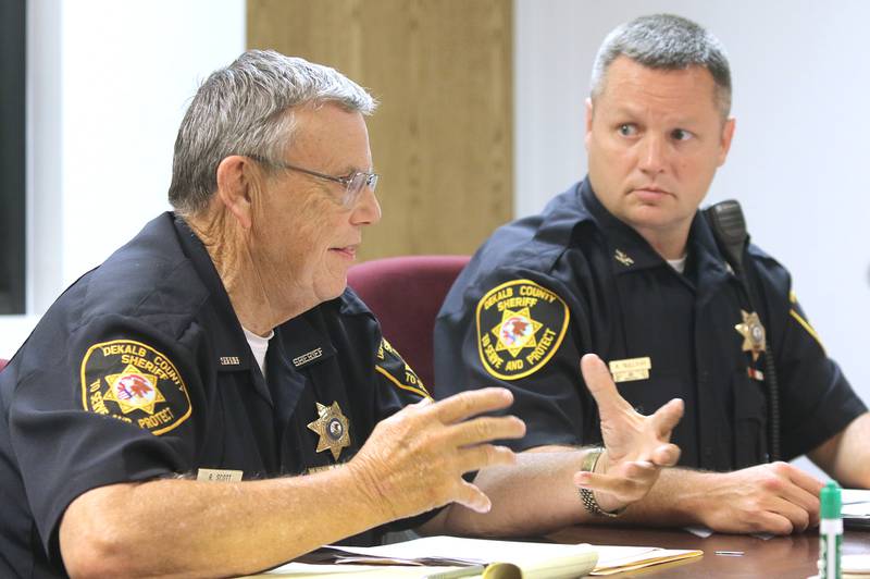 DeKalb County Sheriff Roger Scott (left) and Chief Deputy Andy Sullivan stop by the DeKalb Daily Chronicle office Monday to discuss the status of the two-year-old investigation into the unsolved murders of Patricia and Robert Wilson.