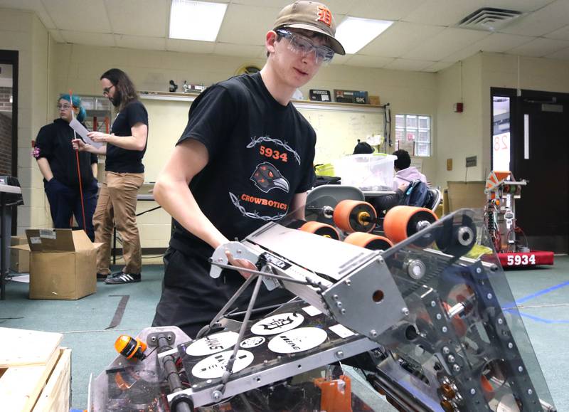 Blake Bollow, a senior at DeKalb High School, works on his teams robot during a Crowbotics team meeting Tuesday, April 10, 2024, at Huntley Middle School in DeKalb. Crowbotics is DeKalb High School’s robotics team who has qualified to compete in the FIRST Robotics Competition World Championship held in Houston, Texas April 17-20.