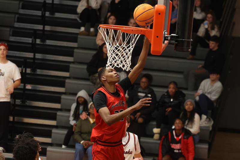 Bolingbrook’s Jayden Madden gets the easy lay up against Minooka on Tuesday, Dec. 17, 2024 in Minooka.