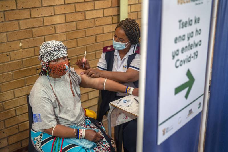 An Orange Farm, South Africa, resident receives her COVID-19 vaccine