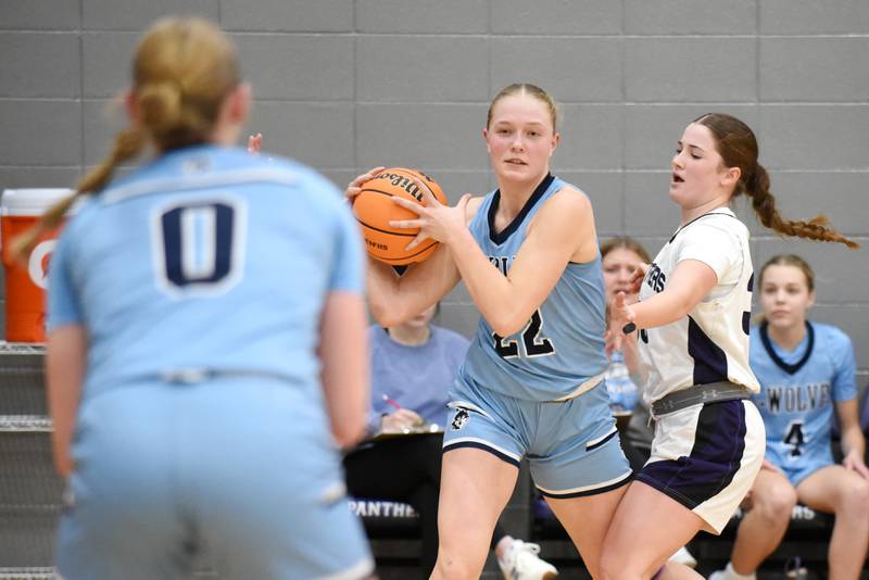 Cissna Park's Josie Neukomm, center, looks to pass to Addison Lucht, left, while Manteno's Kendall Blanchette defends during a game at Manteno Monday, Jan. 19, 2026.
