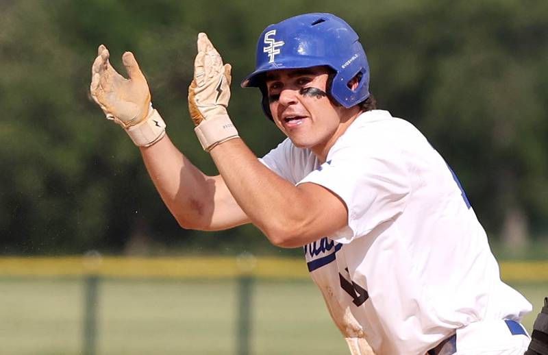 St. Francis' Luc Swiatek claps after hitting a double during their Class 3A regional semifinal game against Sycamore Thursday, June 1, 2023, at Kaneland High School in Maple Park.
