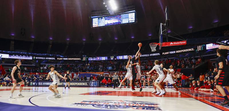 BenetÕs Colin Stack (42) is found with two seconds left to send him to the foul line and put Benet ahead of DePaul College Prep in the last seconds of the IHSA Class 4A boys basketball state semifinal Friday, March 13, 2026 at the State Farm Center in Champaign.