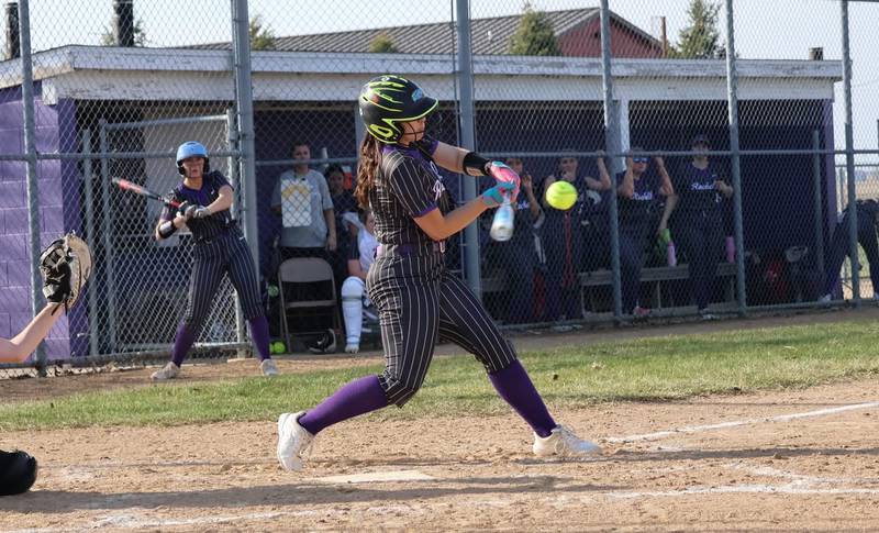 Rochelle's Mya Martinez slugs a homer during Monday's game with Rockford Lutheran.