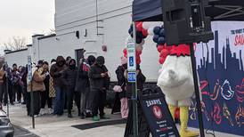 Customers line up in the cold at Zaxby’s in Plainfield for chance of free chicken