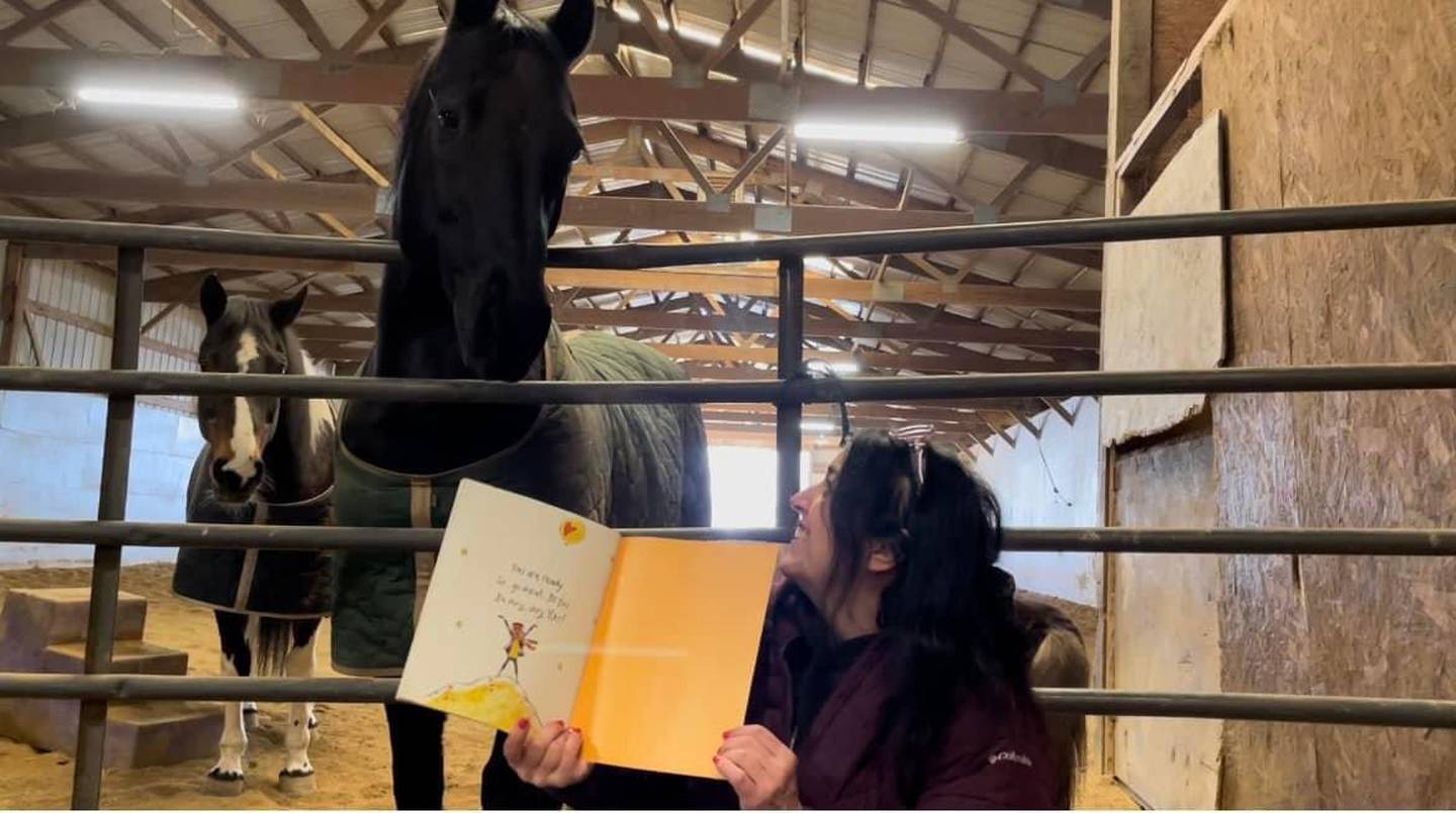 Tammy Ryan, a third grade teacher at Troy Craughwell Elementary School in Joliet, reads and records stories for her students at her friends farm that Ryan's students can watch later. Ryan (right) also hosts a live bedtime story reading each week, called Tuck in Tuesdays, with her boyfriend Tom Swartz. On Tuesday, March 22, 2022, Swartz proposed to Ryan during the reading.