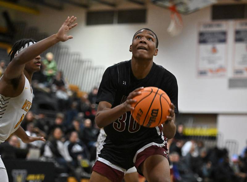 Plainfield North's Pierre Pointer (30) in action during a conference game against Joliet West's on Friday, Dec. 20, 2024, at Joliet.