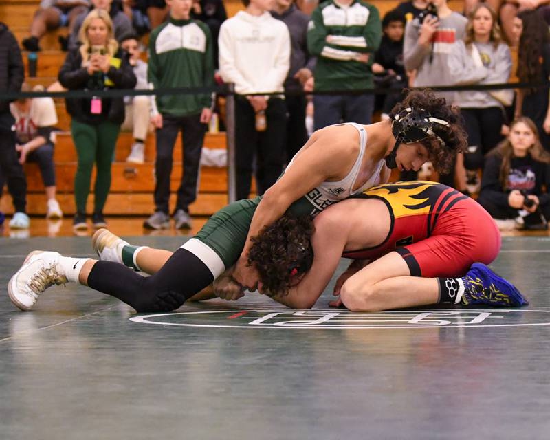 Ulises Rosas of Glenbard West, left, keeps a hold of Batavia wrestler Jack Duraski in the 132 weight class where Jack took the win during the regional title match held on Saturday Feb 3, 2024, at Glenbard West High School.
