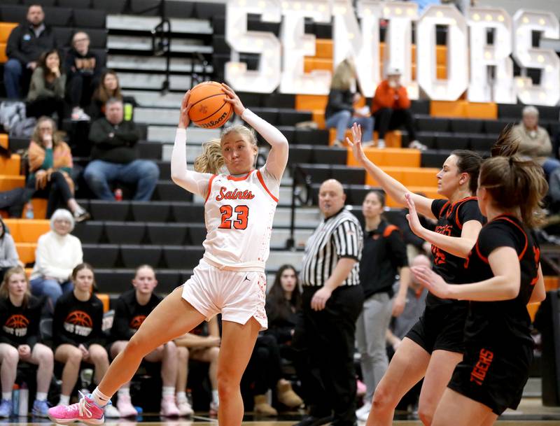 St. Charles East's Alyse Price grabs a rebound during a game against Wheaton Warrenville South on Tuesday, Feb. 11, 2025 in St. Charles.