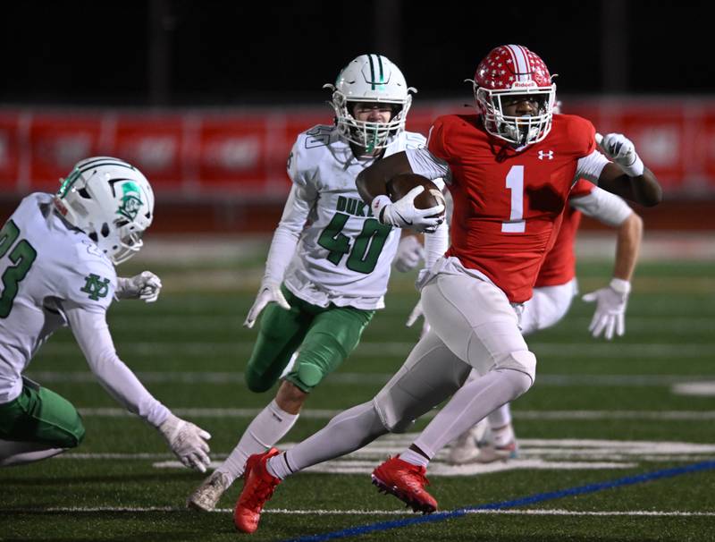 Naperville Central’s DeShaun Williams returns a York kickoff during the Class 8A football state semifinal on Saturday, Nov. 23, 2024 in Naperville.