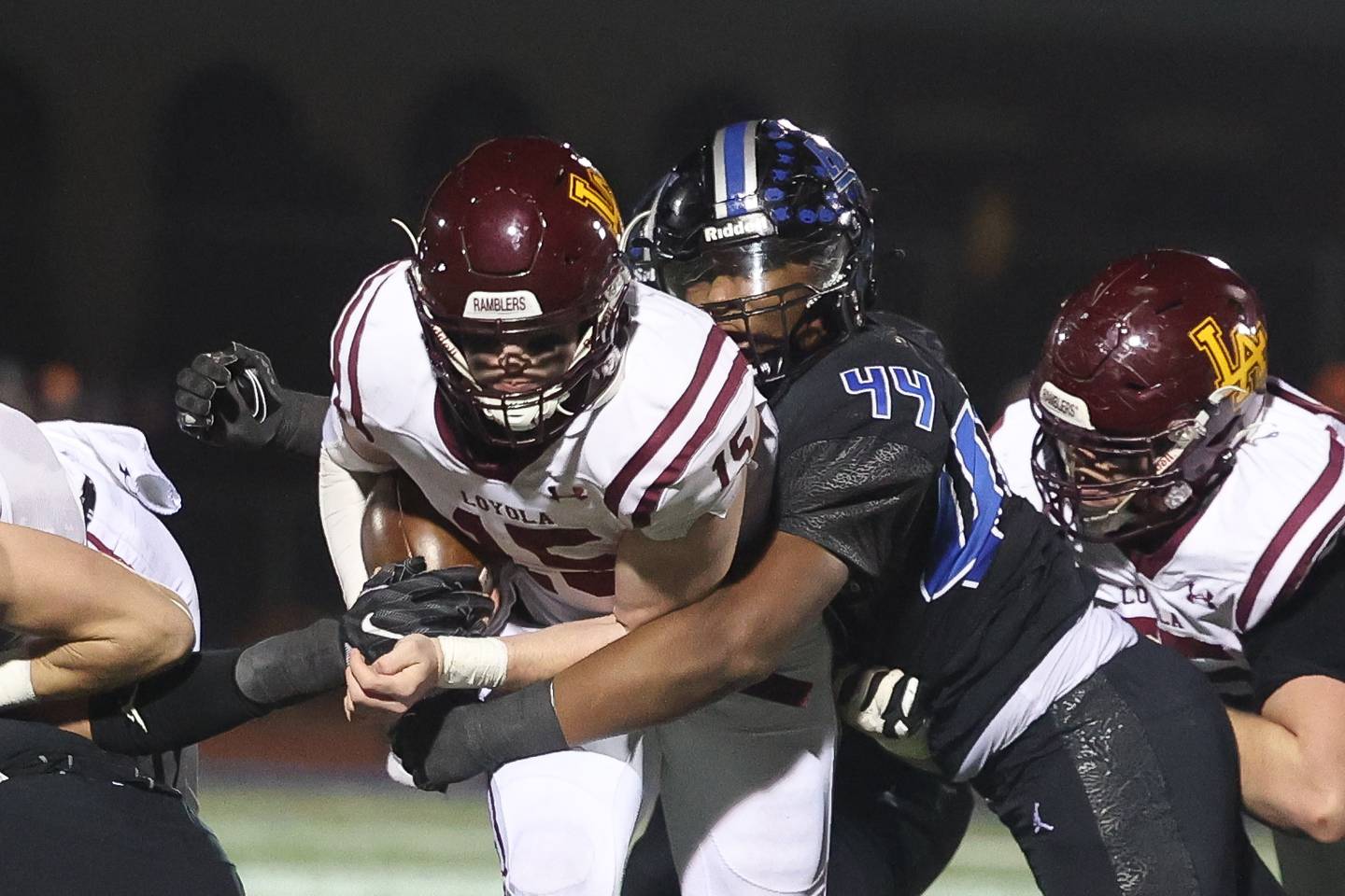 Lincoln-Way East’s Jacob Alexander wraps up Loyola’s Ryan Fitzgerald in the Class 8A semifinal on Saturday, Nov. 23, 2024 in Frankfort.