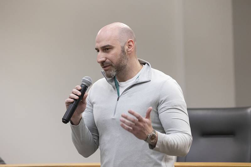 Dr. Tyrone Brand praises the actions of Officer Collin Grady on Monday for saving a person's life on Jan. 8.