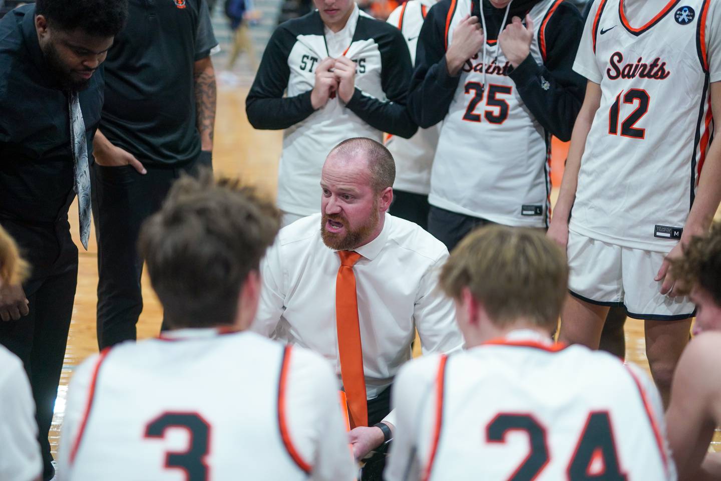 St. Charles East's head coach Rob Klemm talks to his players during the 64th annual Ron Johnson Thanksgiving Basketball Tournament at St. Charles East High School on Monday, Nov 20, 2023.