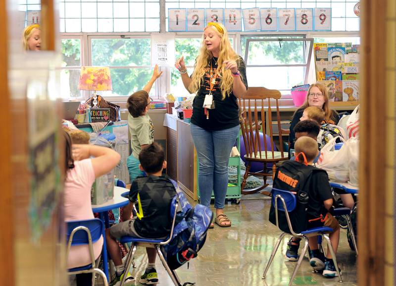 First-grade teacher Kaylee Hill gets to know her new students on the first day of school at Haskin Elementary in Sandwich on Wednesday, Aug. 17, 2023.