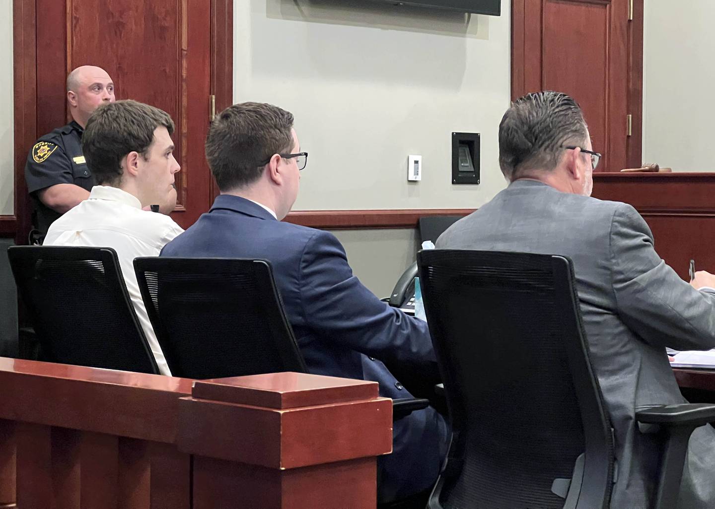 Kevin A. Schmidt, 35, dressed in white, was found to be unfit to stand trial on Monday, May 18, 2026, at the DeKalb County Courthouse in Sycamore, for murder charges he's facing related to the killings of his parents, Gary and Holly Schmidt.