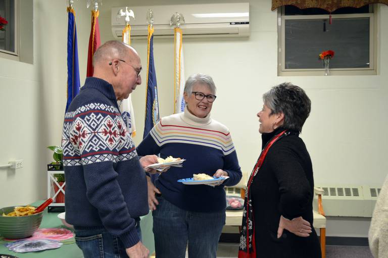 Paula Diehl, right, speaks to Mary and Jim Francis, of Mt. Morris, during her retirement party on Dec. 30 at the Mt. Morris Senior Center. Diehl, who served as Mt. Morris village clerk for more than 18 years, retired from the position at the end of 2022.