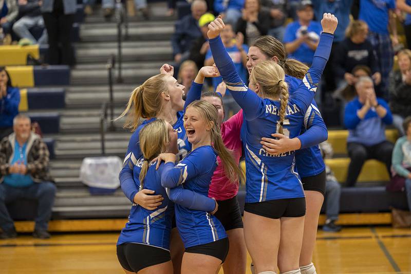 Newman celebrates a  27-25 win in game two of their regional semifinal against Eastland to take the match Wednesday, Oct. 26, 2022.