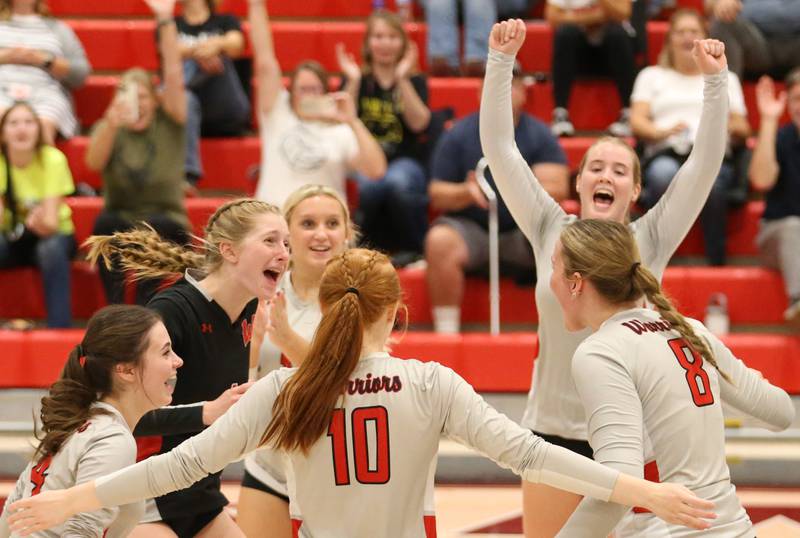 Members of the Woodland volleyball team celebrate their win over Earlville on Wednesday Sept. 25, 2024 at Woodland High School.