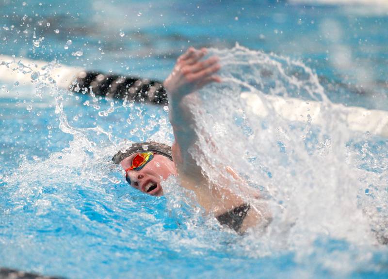 St. Charles East’s Lulu Negro competes in the 400-yard freestyle relay consolation heat during the IHSA Girls State Swimming and Diving Championships at the FMC Natatorium in Westmont on Saturday, Nov. 11, 2023.