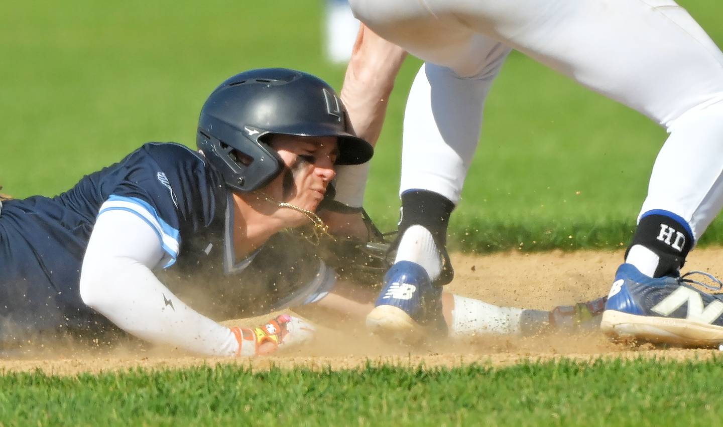 St. Charles North’s Jackson Spring tags out Lake Park’s Derek Ittner on a pickoff from pitcher Josh Caccia in the first inning in a baseball game in St. Charles on Wednesday, May 8, 2024.