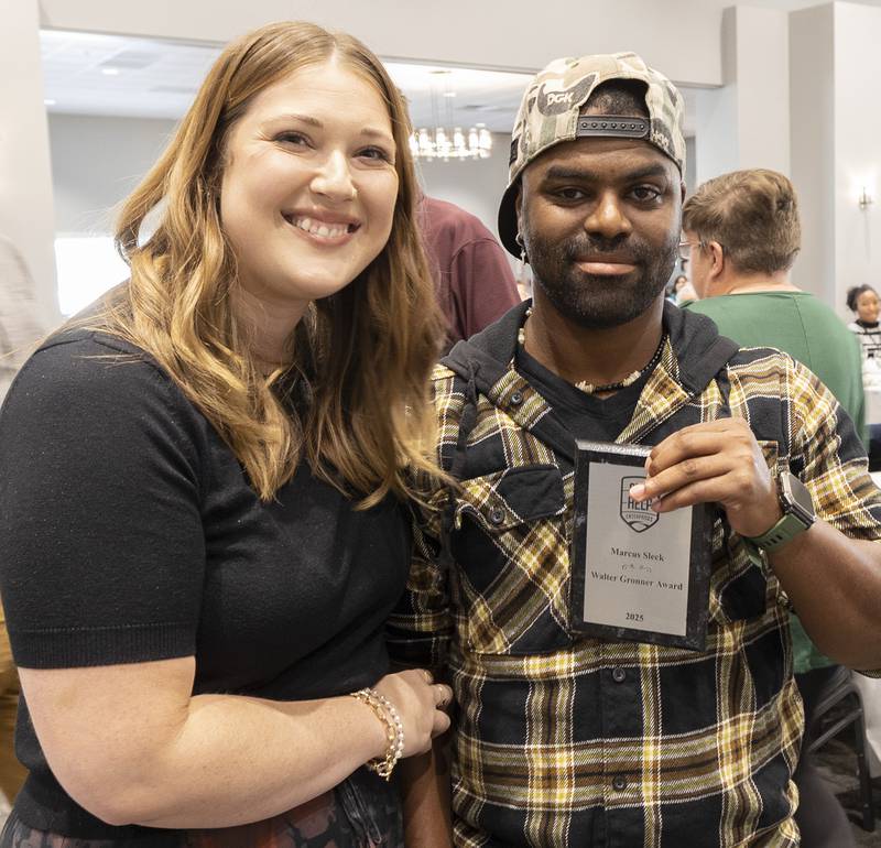 Maggie Hofsommer presents Marcus Sleck with the Best Worker Award Thursday, Oct. 16, 2025, during the annual Self Help Awards.