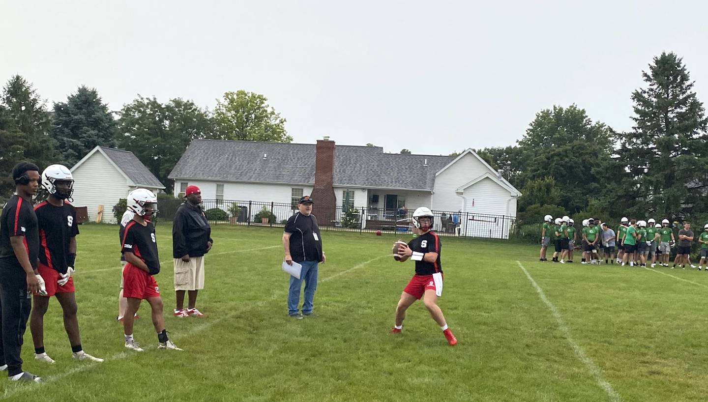 Streator quarterback Isaiah Weibel surveys the field Tuesday, July 9, 2024, during a 7-on-7 scrimmage in Dwight.