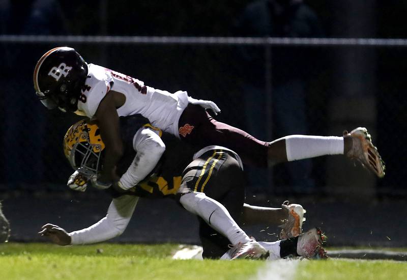 Jacobs' Antonio Brown is tackled by Brother Rice's Mackenzie Alleyne during a IHSA Class 7A first round playoff football game Friday, Oct. 28, 2022, between Jacobs and Brother Rice at Jacobs High School in Algonquin.