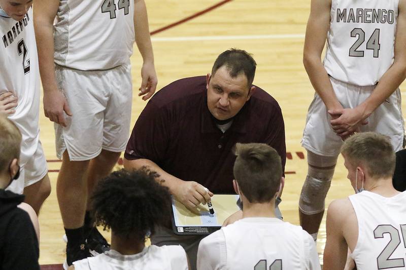 Marengo coach Nate Wright talks with the team in a timeout against Grayslake North during their EC Nichols Holiday Tournament boys basketball game on Monday, Dec. 20, 2021 at Marengo Community Unit High School in Marengo.