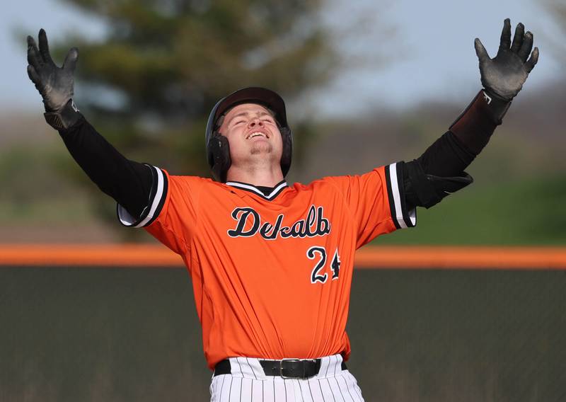 DeKalb's Evan Johnson celebrates after hitting a double Monday, April 20, 2026, during their game against Waubonsie Valley at DeKalb High School.