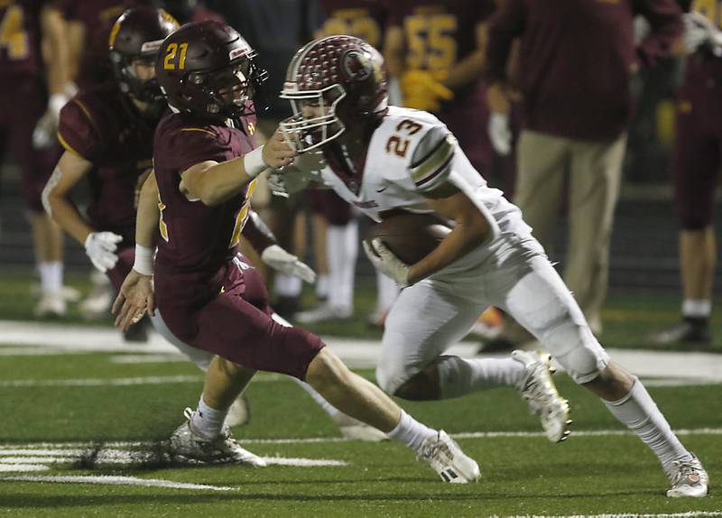 Richmond-Burton's Peyton Petersen tries to tackle Morris’ AJ Zweeres during a Kishwaukee River Conference / Interstate 8 Conference crossover football game Friday, Sept. 30, 2022, between Richmond-Burton and Morris at Richmond-Burton Community High School in Richmond.