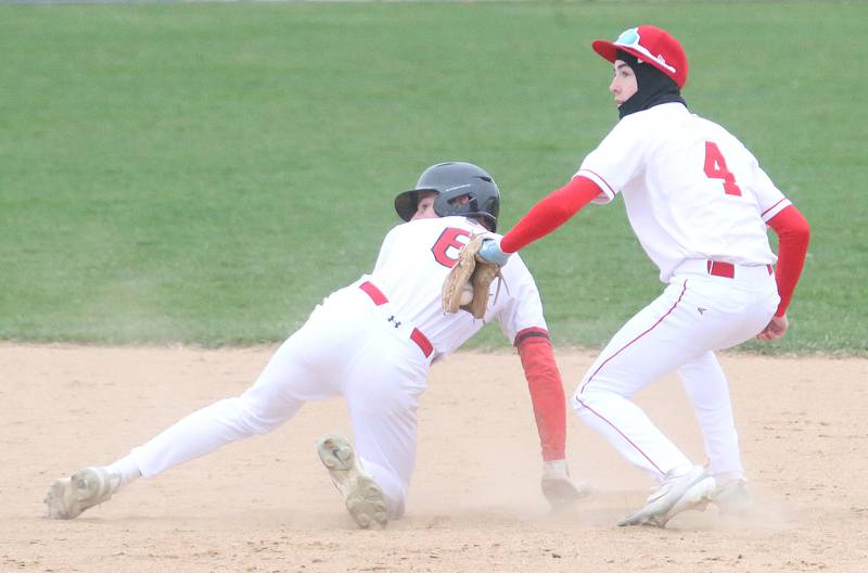 Hall's Hunter Edgcomb steals second base as Ottawa's Colt Bryson waits for the late throw on Tuesday, April 1, 2025 at Ottawa High School.