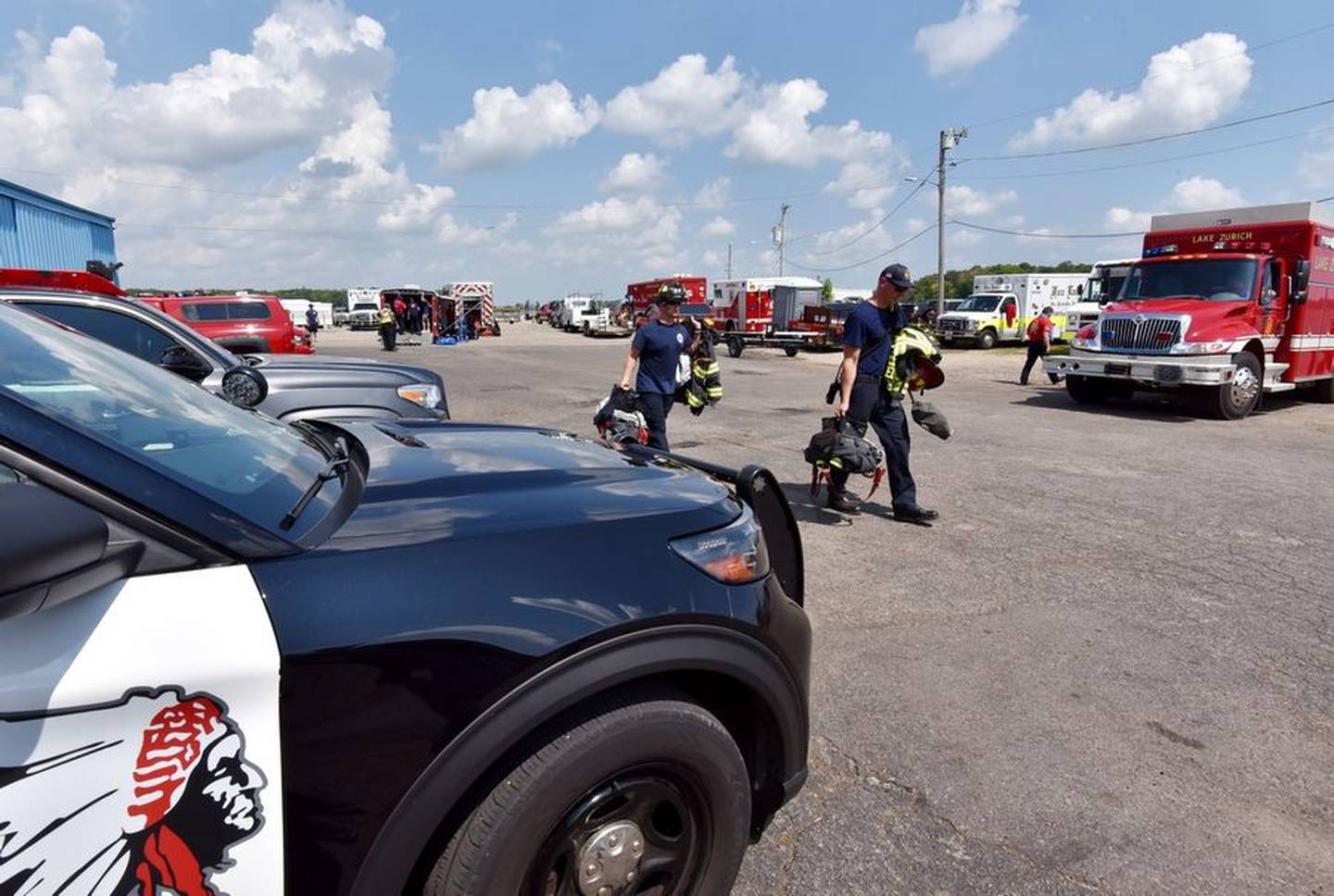 Several fire departments and at least six fire department boats search Fox Lake, south of Crabtree Island, for a person who was on a boat that flipped over Friday. Three other people who were on the boat are safe, authorities said.