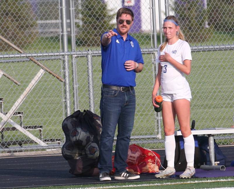 Princeton head girls soccer coach David Gray coaches his team while talking to teammate Chloe Ostrowski during the Class 1A Regional semifinal game on Tuesday, May 9, 2023 at Mendota High School.