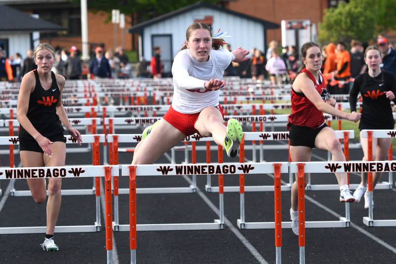 Oregon's Jillian Hammer (center) looks at the clock as she crosses the finish line first in the 100 meters hurdles at the 1A Winnebago Sectional on Wednesday, May 13, 2026.