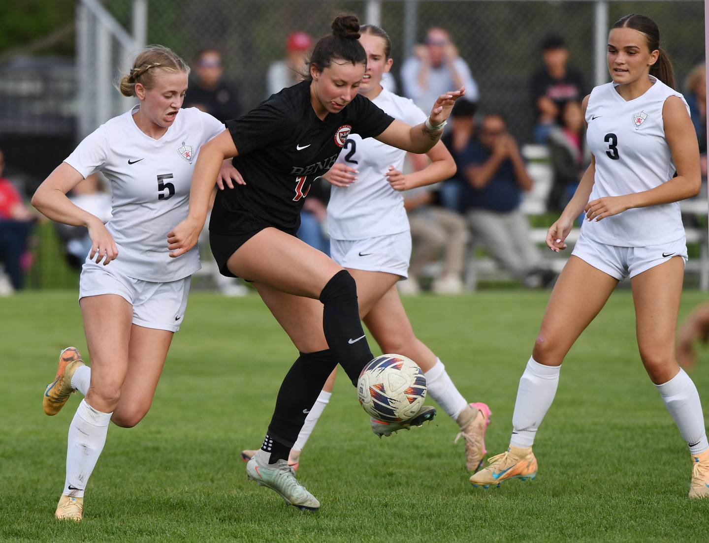 Benet Academy’s Genevieve Burda, right, gets to the ball ahead of St. Viator’s Maggie Drake during Tuesday’s girls soccer match in Lisle.
