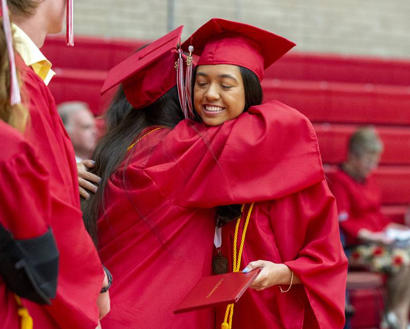 Ella Marvel hugs a class officer during the Ottawa High School commencement Friday, May 27, 2022.