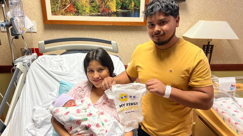 Parents Ulises (right) and Alexandra welcomed their baby boy at 7:29 a.m. on Monday, April 8, 2024, the day of the solar eclipse at Northwestern Medicine Kishwaukee Hospital in DeKalb. Hospital nurses gifted the parents with a special eclipse onsie to mark the occasion.