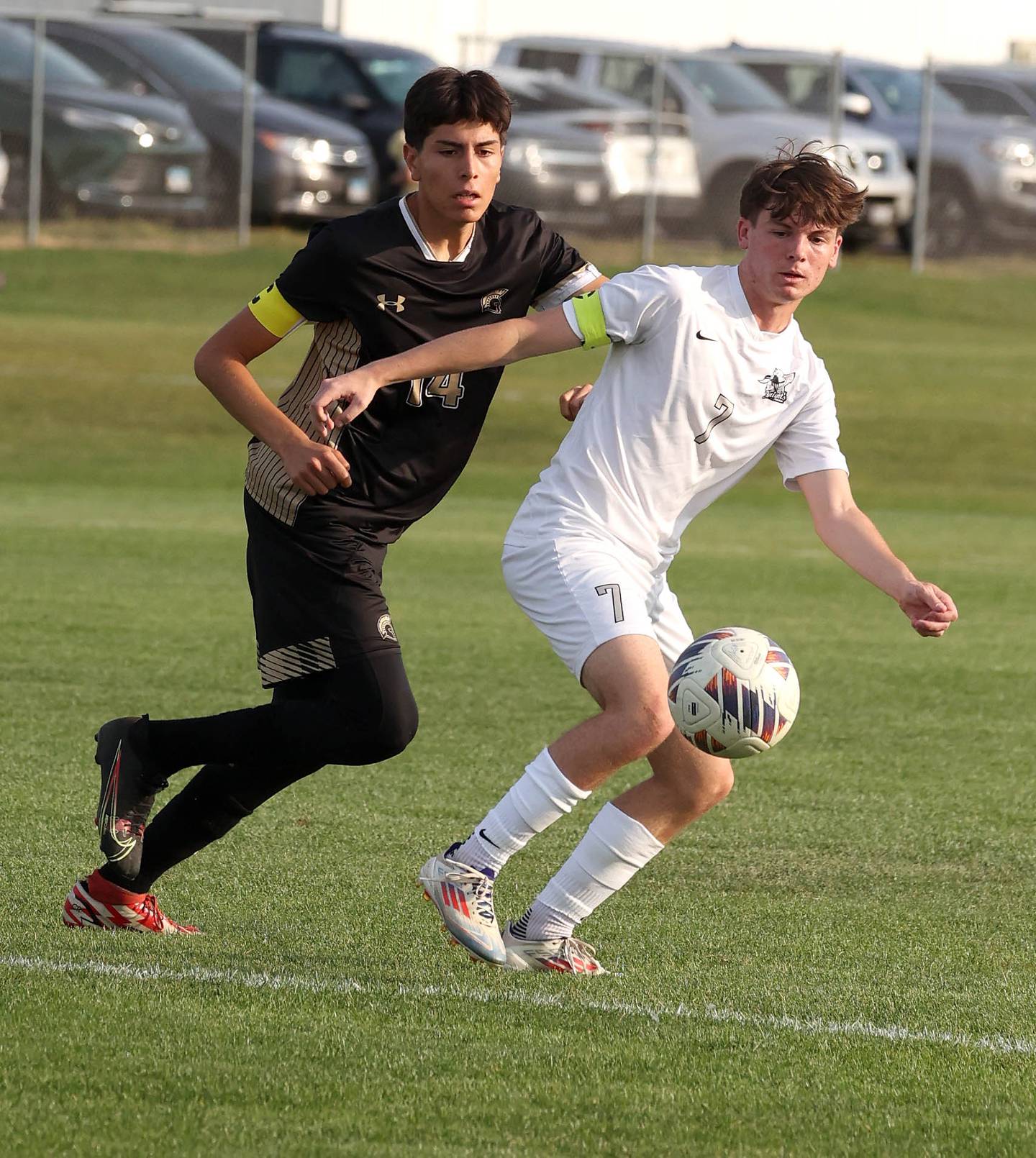 Sycamore's Javier Lopez (left) and Kaneland's Cameron Guernon go after a loose ball during their game Wednesday, Sept. 18, 2024, at Sycamore High School.