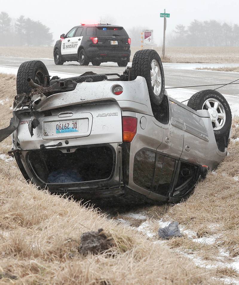 A DeKalb County Sheriff's SUV blocks off Perry Road near Howison Road just south of DeKalb Thursday, Feb. 16, 2023, after two separate vehicles slid off the road. Winter weather resulted in several accidents in DeKalb County Thursday.