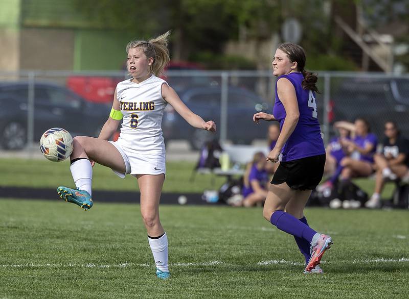 Sterling’s Lainey Block controls the ball against Dixon’s Carlie Cook Tuesday, May 9, 2023.