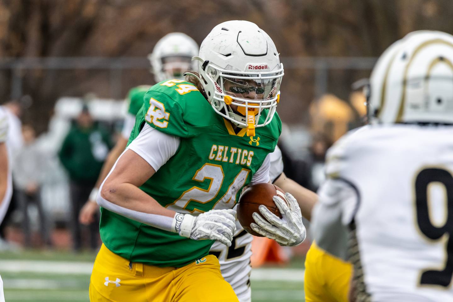 Providence's Broden Mackert picks-up yardage during a 5A varsity football semifinal game against Oak Forest at Providence Catholic High School on Nov. 22, 2025.