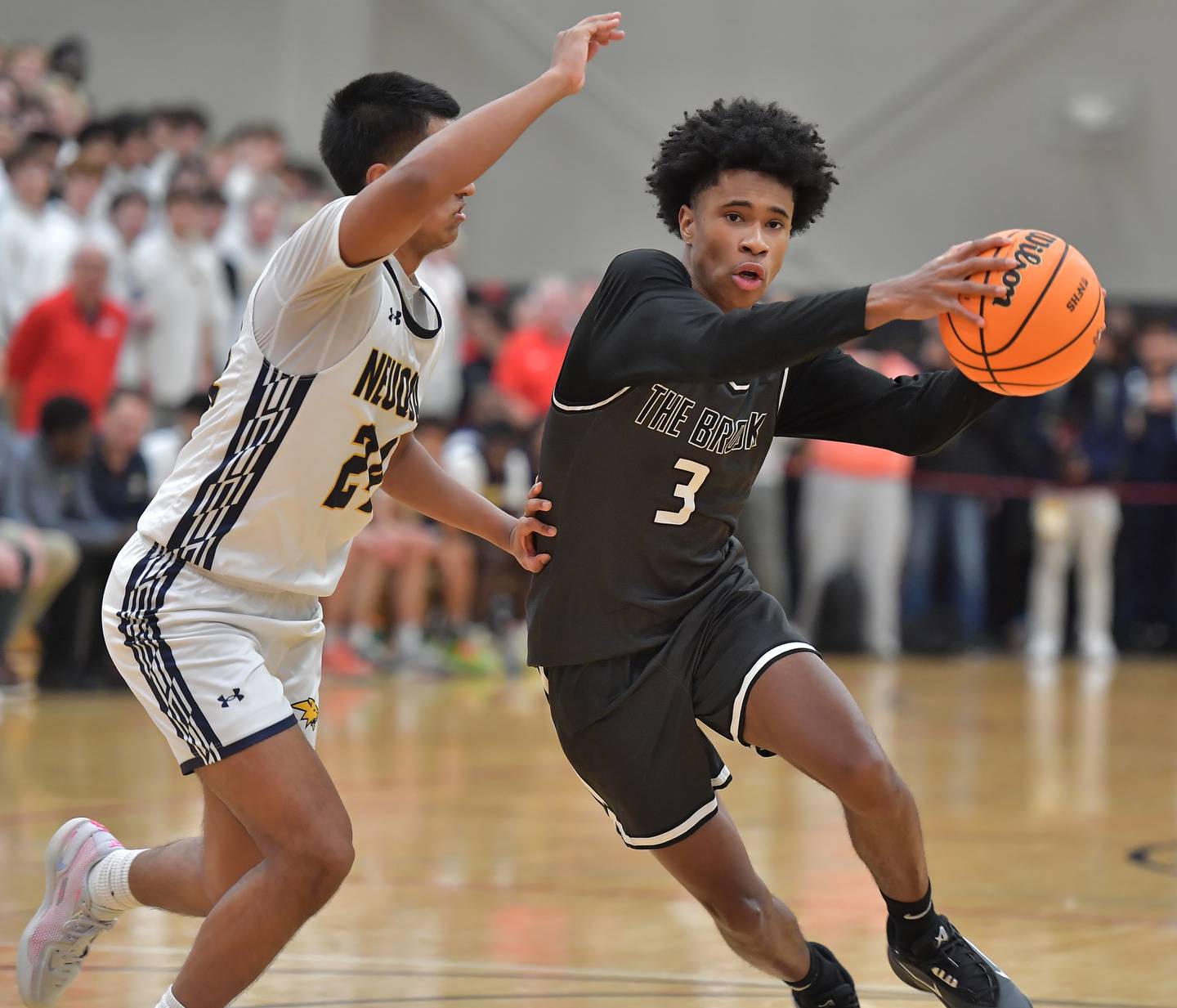 Bolingbrook’s TJ Williams (3) drives to the basket during a When Sides Collide Shootout game against Neuqua Valley on January 24, 2026 at Benet Academy in Lisle.