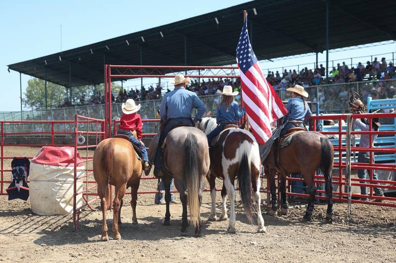 A rodeo family waits to enter the arena before the start of the I.P.R.A. World Championship Rodeo at the Will County Fair on Sunday, August 25, 2024 in Peotone.