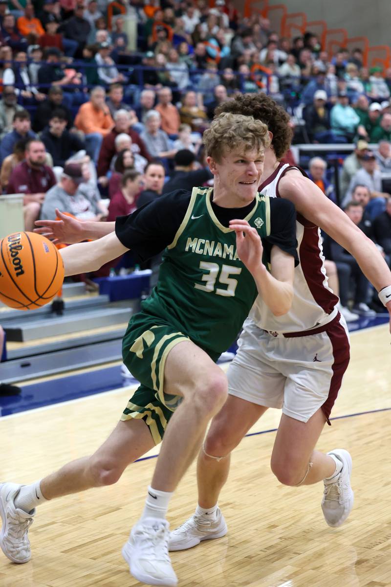 Bishop McNamara's Richard Darr drives to the lane under pressure during the Fightin' Irish's 77-70 loss to Tolono Unity in the IHSA Class 2A Pontiac Supersectional on Monday, March 9, 2026.