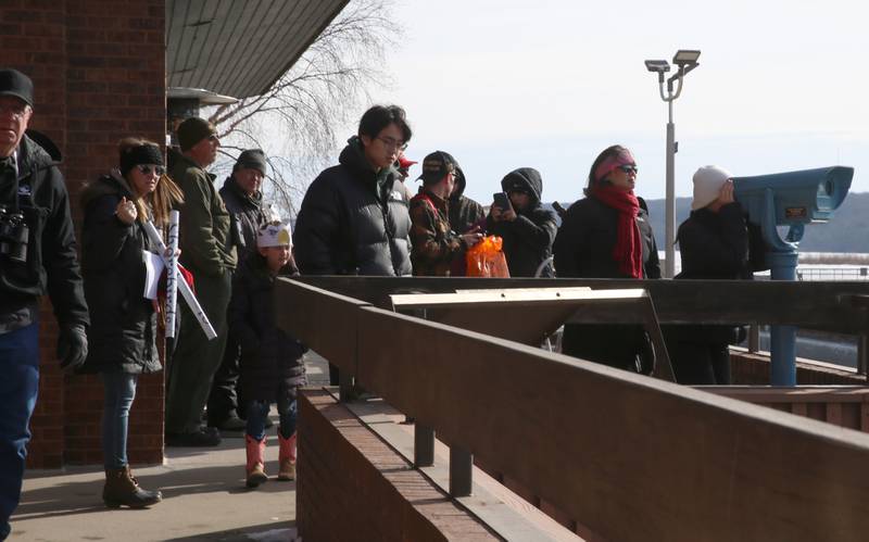 Dozens of visitors watch for eagles during Eagle Watch Weekend on Saturday, Jan. 25, 2025 at the Illinios Waterway Visitors Center at the Starved Rock Lock and Dam.