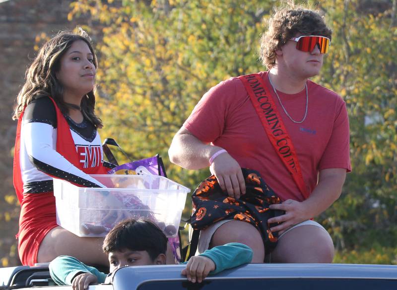 Hall queen and king candidates Valery Arzaga and Payton Dye ride in the Hall High School Homecoming parade on Thursday, Sept. 28, 2023 in Spring Valley.