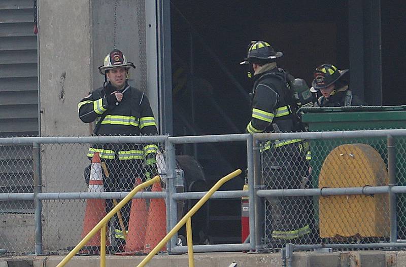 Utica fire Chief Ben Brown, (left) gathers at the entrance to the Peru Hydroelectric Power Plant on Tuesday, Jan. 13, 2026 at the Starved Rock Lock and Dam near Utica. A light haze of smoke was coming from inside the power plant. Fire departments from Tonica, La Salle, Wallace, Tonica, Peru and Utica all responded to the scene. The incident happened shortly before 2:30p.m. No injuries were reported.