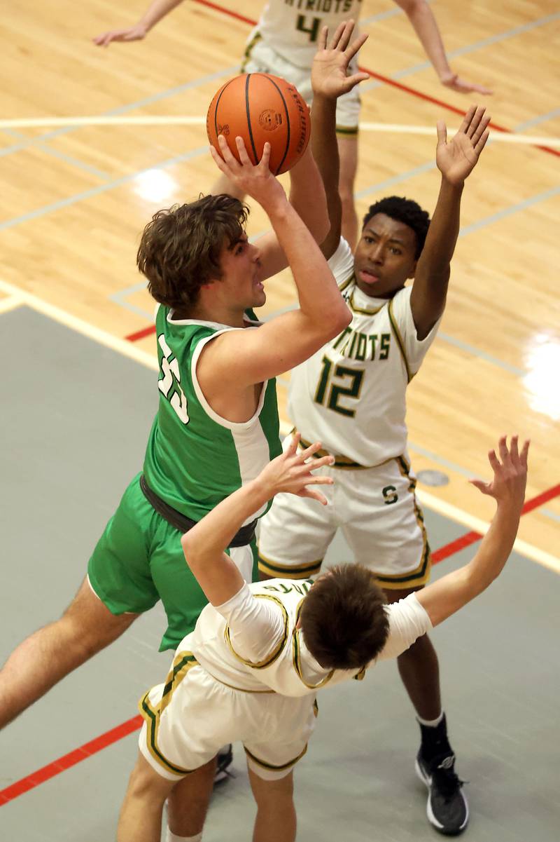 StevensonÕs Armand Burris (12) and Rocco Pagliocca (5) try to contain YorkÕs Braden Richardson (35) Saturday November 25, 2023 at the Ed Molitor Thanksgiving Classic in Palatine.