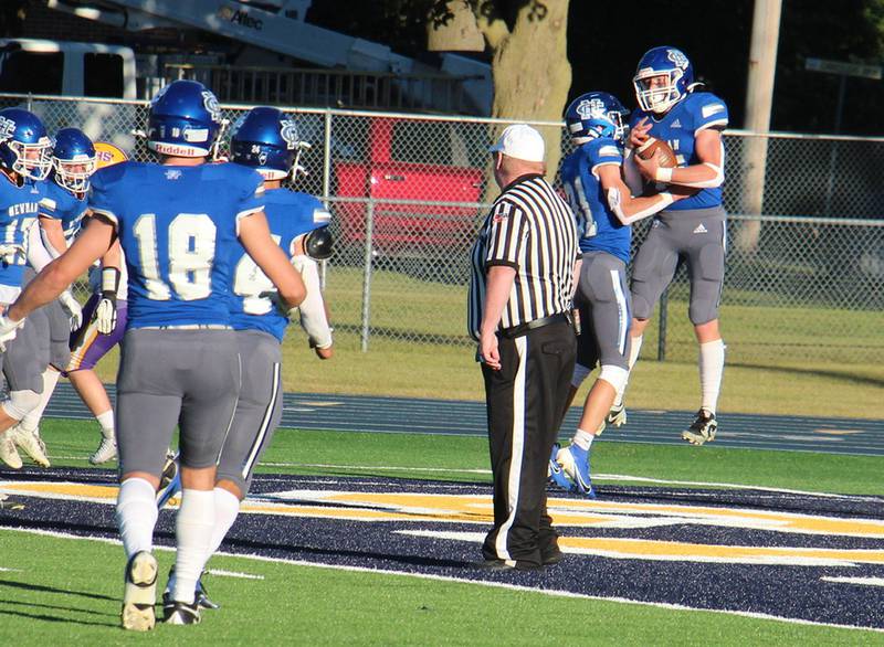 Newman’s Daniel Kelly (right) and Cody McBride celebrate Kelly’s TD Saturday, Sept. 7, 2024, against Mendota. Newman beat the Trojans 42-0.